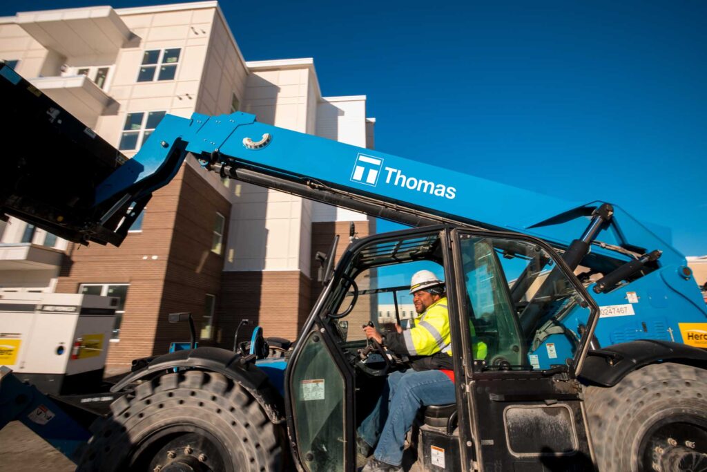 Thomas Construction logo at work