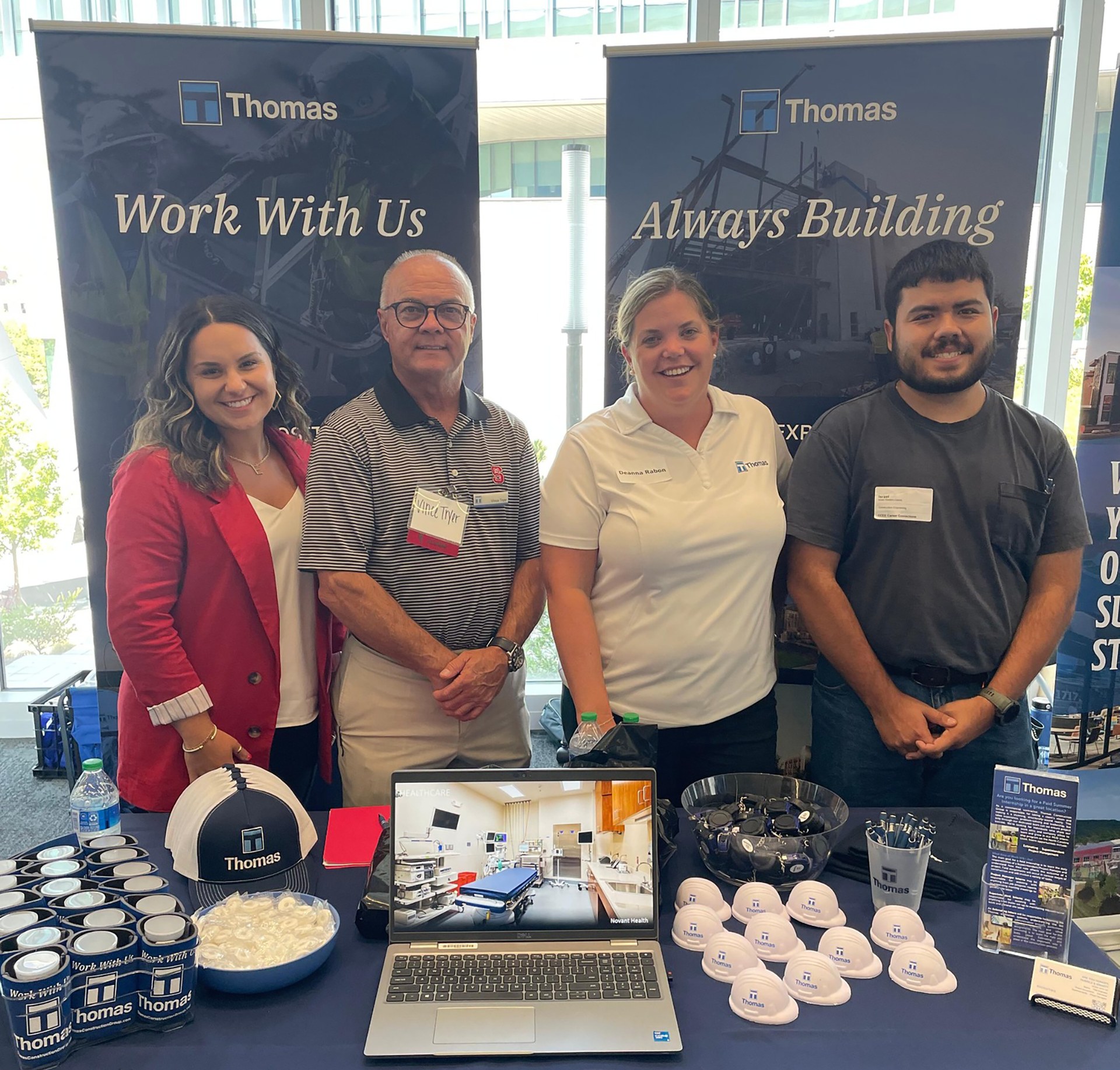 Three Thomas employees at NC State for a career fair