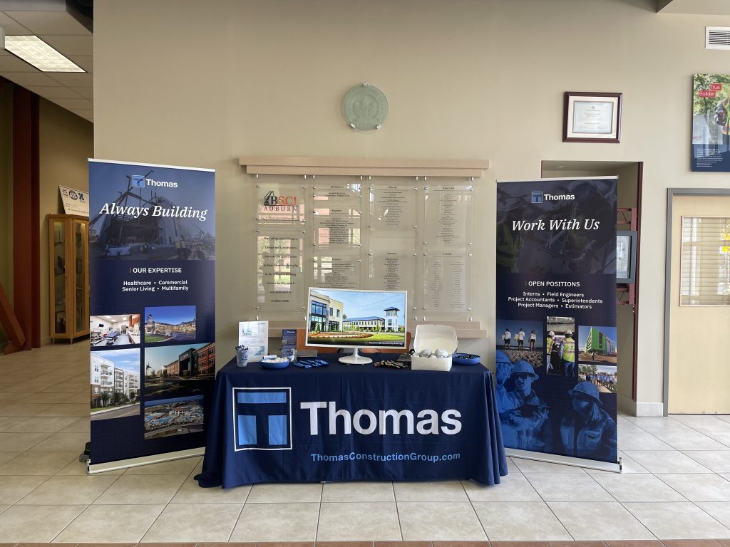Thomas table and banners set up for a career fair at Auburn University