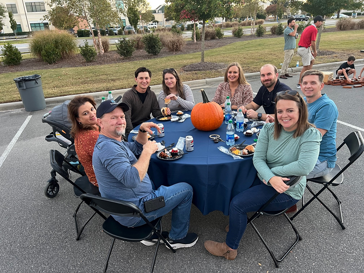 Table of Thomas employees sitting at Oyster Roast