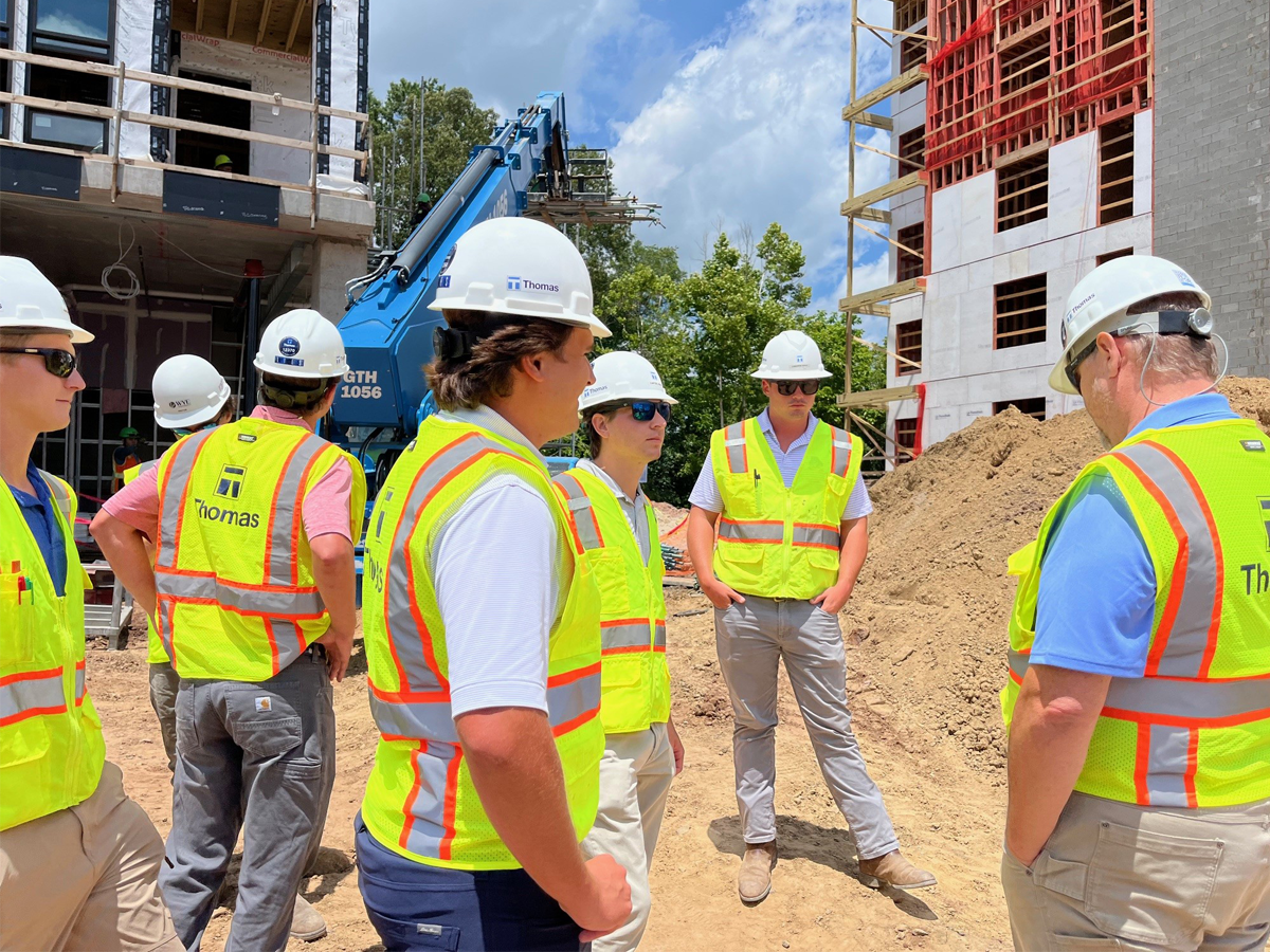 Group tour on site with vests and hard hats